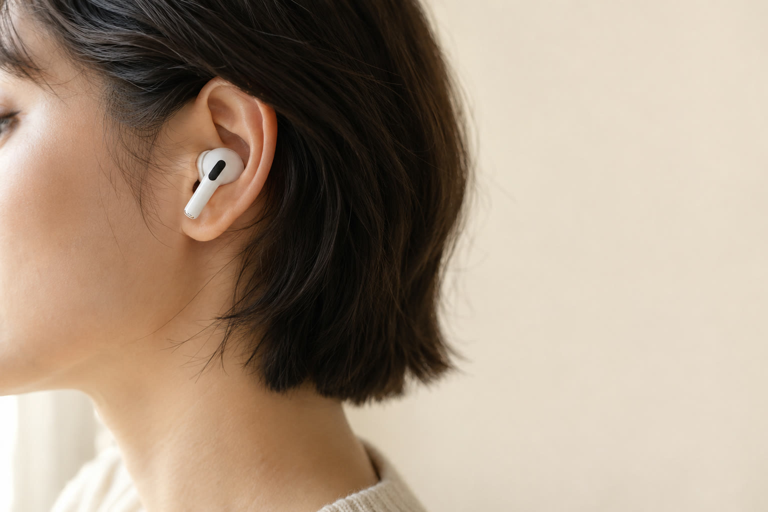 An AirPods Pro earbud in someone’s ear